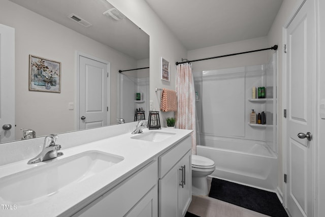 full bathroom featuring vanity, shower / bath combination with curtain, and toilet