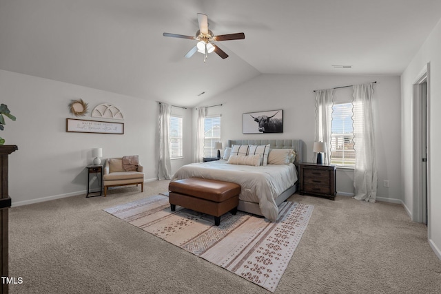 carpeted bedroom featuring lofted ceiling and ceiling fan