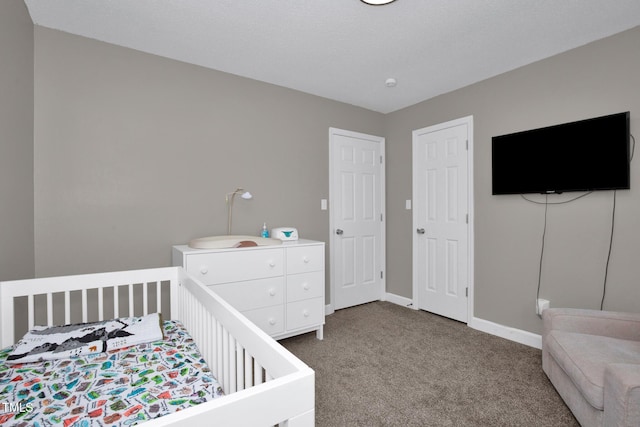 bedroom featuring carpet flooring and baseboards