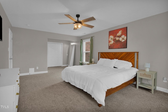 bedroom featuring a closet, baseboards, carpet floors, and ceiling fan