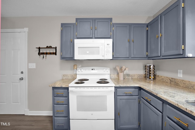 kitchen featuring white appliances, baseboards, dark wood finished floors, blue cabinetry, and a textured ceiling