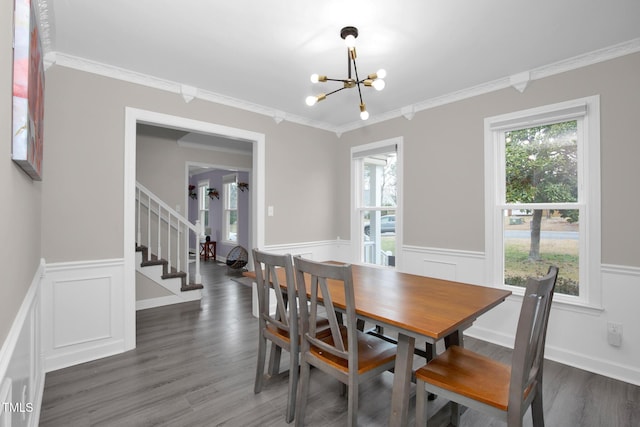 dining area with stairs, an inviting chandelier, a healthy amount of sunlight, and ornamental molding