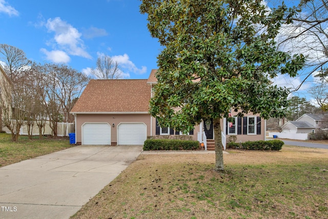 view of front of home featuring a garage, concrete driveway, a front yard, and a shingled roof