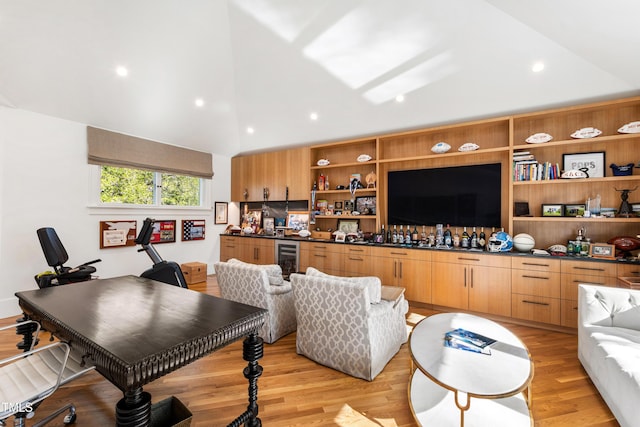 living room with a bar, wine cooler, vaulted ceiling, light wood-type flooring, and recessed lighting