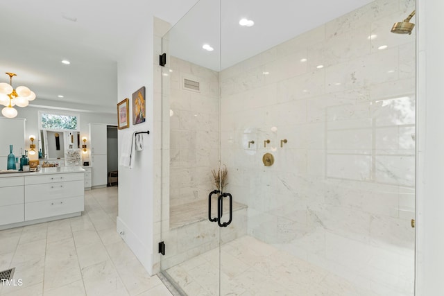 bathroom featuring marble finish floor, recessed lighting, visible vents, a stall shower, and vanity