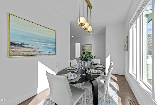 dining space featuring dark hardwood / wood-style floors