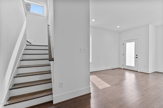 stairs with hardwood / wood-style flooring