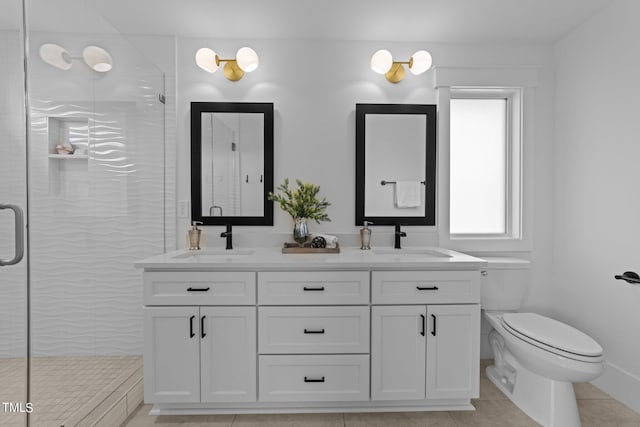 bathroom featuring vanity, tile patterned flooring, a shower with shower door, and toilet