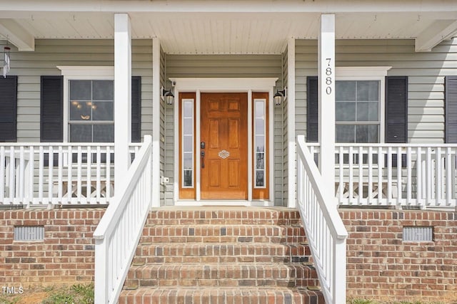 entrance to property featuring covered porch