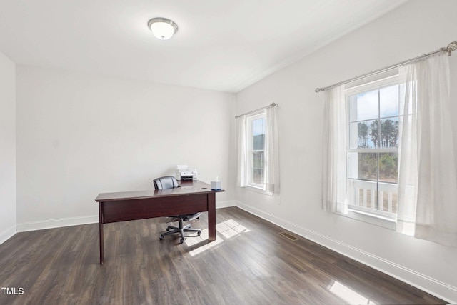 office space featuring visible vents, baseboards, and wood finished floors