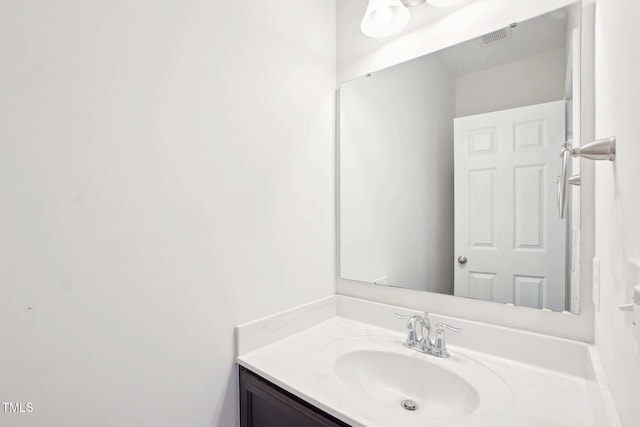 bathroom with visible vents and vanity