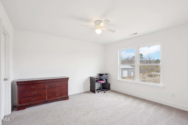 unfurnished bedroom featuring a ceiling fan, carpet, visible vents, and baseboards