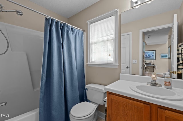 full bathroom featuring vanity, shower / bath combination with curtain, a textured ceiling, and toilet