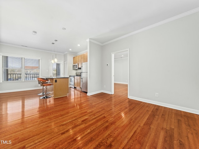 unfurnished living room with light wood-style floors and crown molding