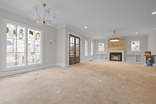 unfurnished living room featuring recessed lighting, a large fireplace, baseboards, french doors, and crown molding