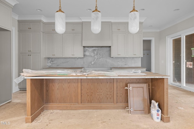 kitchen with ornamental molding, light countertops, tasteful backsplash, and pendant lighting