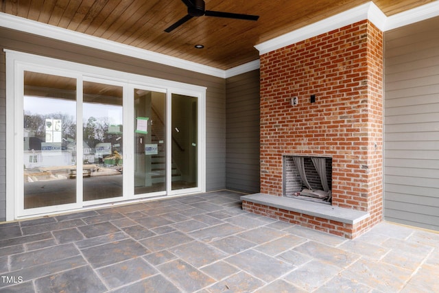 view of patio with ceiling fan and an outdoor brick fireplace