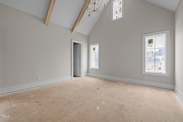 spare room with baseboards, high vaulted ceiling, and beamed ceiling