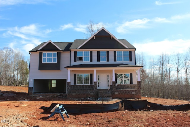 craftsman-style home with a garage and covered porch