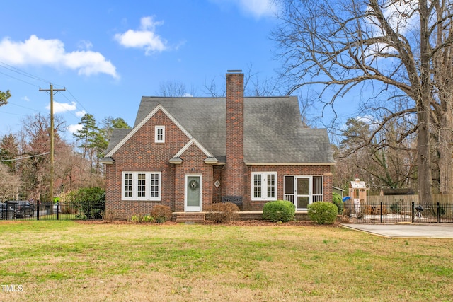 view of front of property with a patio and a front lawn