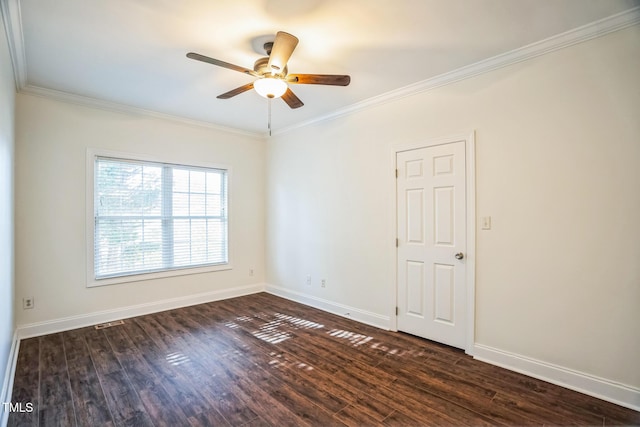 empty room with baseboards, dark wood-style flooring, ceiling fan, and crown molding