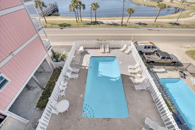 view of swimming pool featuring a patio area