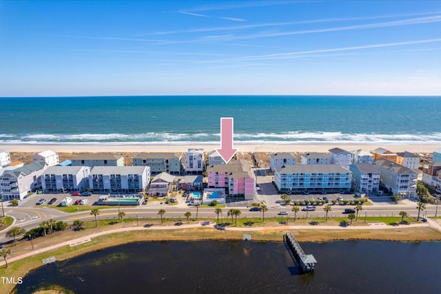 aerial view with a view of the beach and a water view