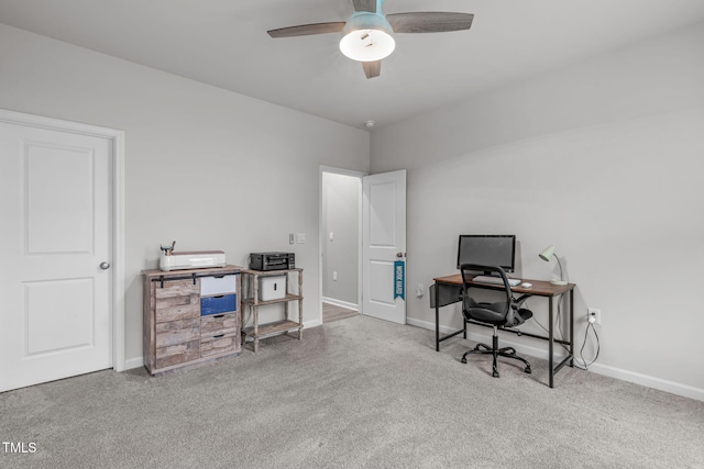 office space featuring a ceiling fan, baseboards, and carpet flooring