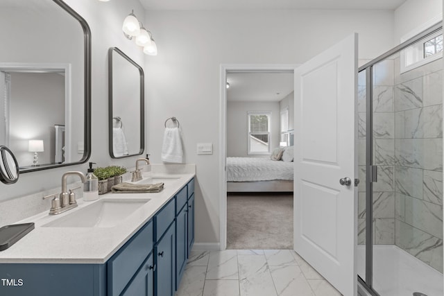 bathroom with marble finish floor, a sink, a shower stall, and ensuite bathroom