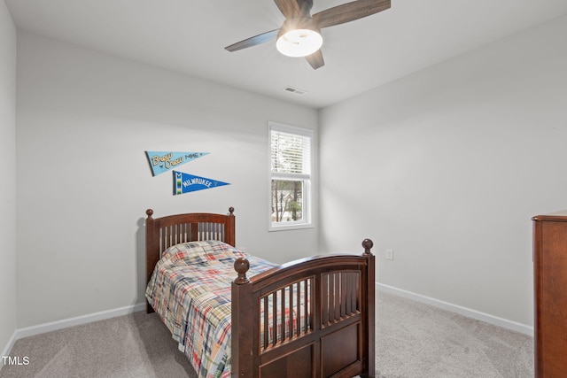 bedroom with light colored carpet, visible vents, and baseboards