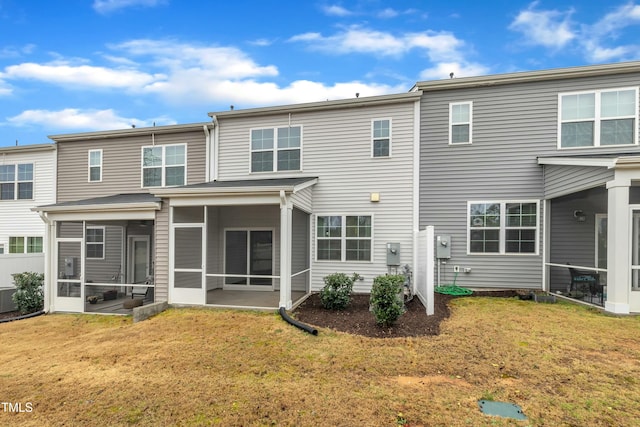 back of house featuring a yard, central AC, and a sunroom