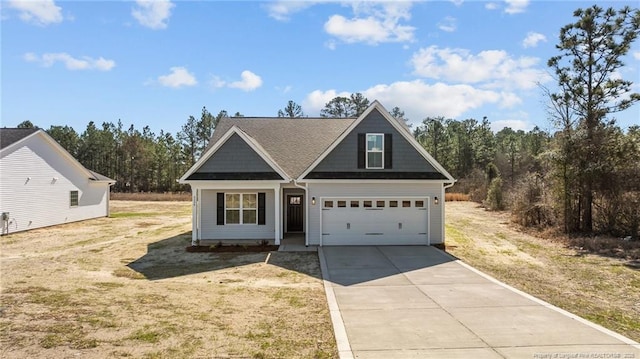 view of front of property with a garage and a front yard