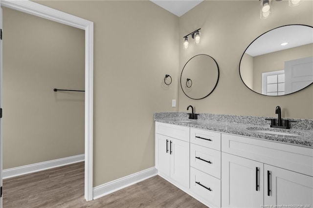 bathroom with vanity and hardwood / wood-style floors