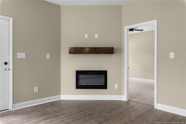 unfurnished living room featuring hardwood / wood-style flooring