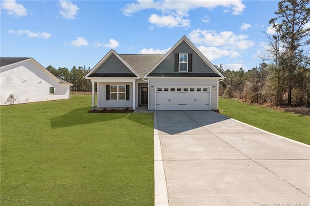 craftsman house featuring a garage, driveway, and a front yard