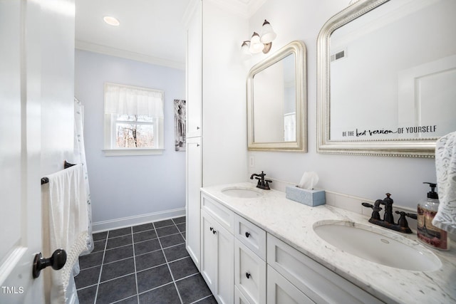 bathroom with tile patterned flooring, crown molding, visible vents, and a sink