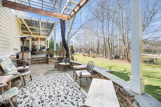 view of patio / terrace featuring fence and a pergola