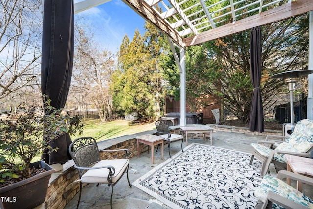 view of patio / terrace featuring a hot tub, fence, and a pergola