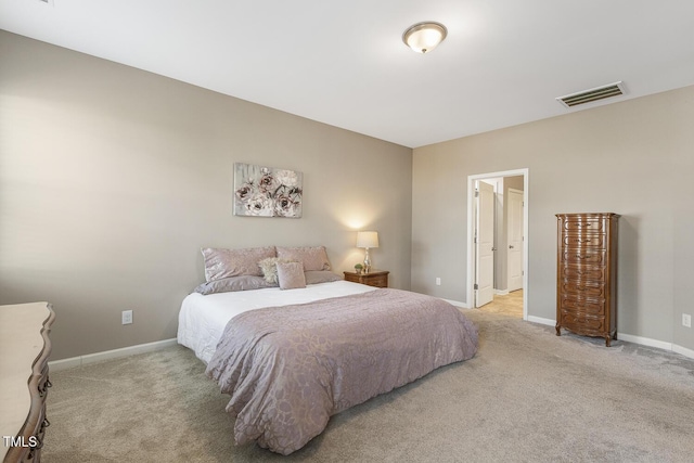 carpeted bedroom with visible vents and baseboards