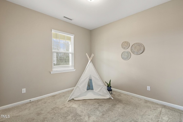 game room featuring carpet, visible vents, and baseboards