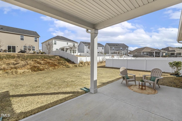 view of patio with fence private yard and a residential view