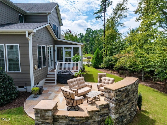 view of patio with a sunroom and outdoor lounge area