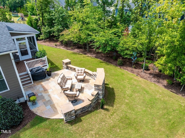 view of yard with an outdoor fire pit and a patio