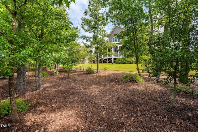 view of yard featuring a sunroom