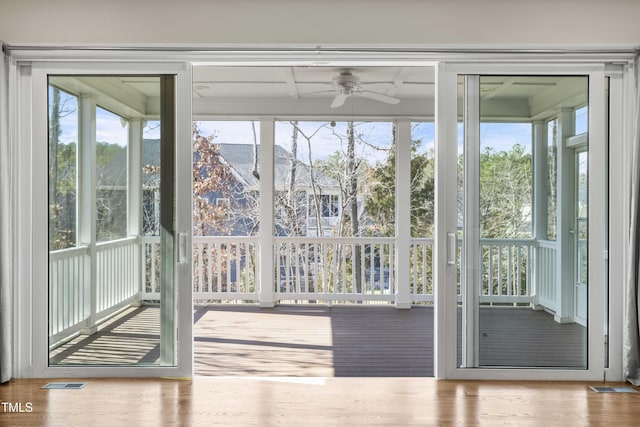 entryway with a ceiling fan, visible vents, and light wood-style flooring