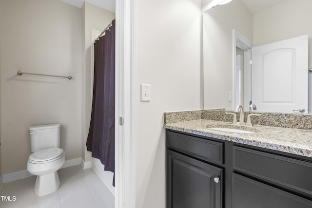 full bathroom with baseboards, vanity, toilet, and tile patterned floors