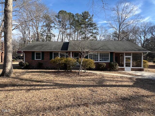 single story home with a sunroom