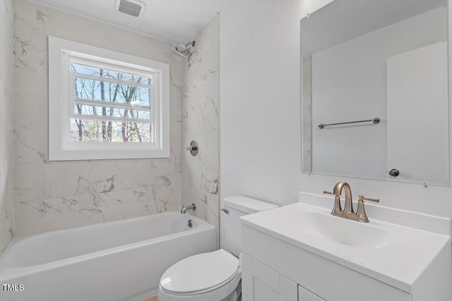 full bath with visible vents, bathing tub / shower combination, vanity, and toilet