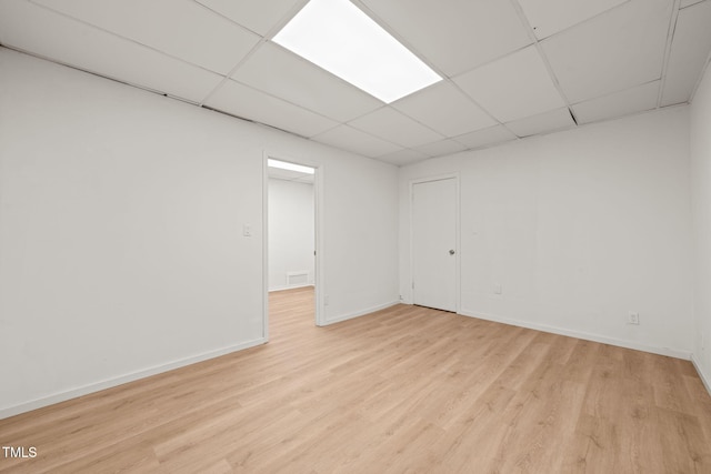 1411 Rosewood St, Durham, NC 27701 - finished below grade area with light wood finished floors, baseboards, and a drop ceiling