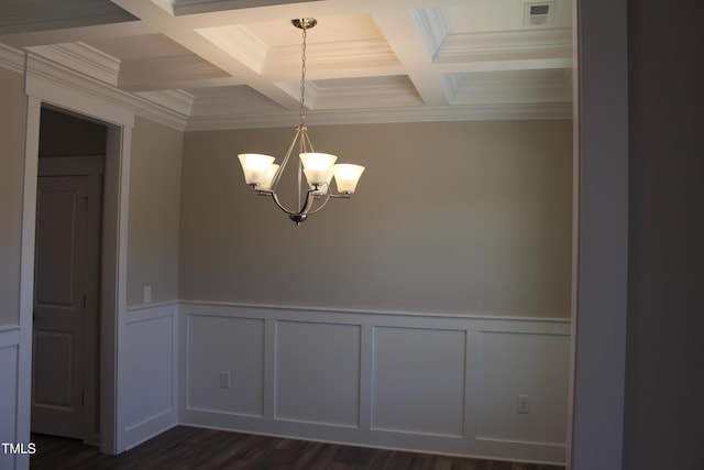 unfurnished room featuring an inviting chandelier, coffered ceiling, dark hardwood / wood-style floors, and beamed ceiling